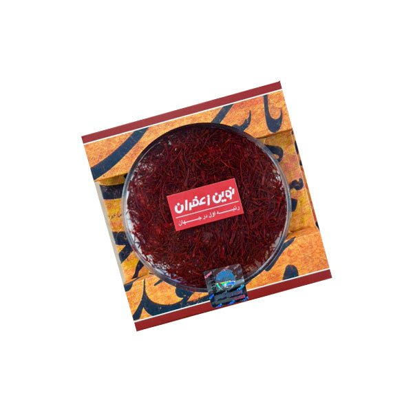 Saffron in a decorative box with a brand label on a white background