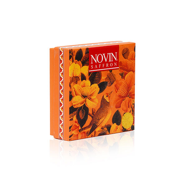 Novin Saffron packaging with floral design and bird illustration on a white background